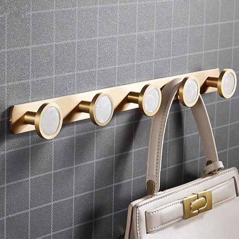 Barre porte manteau dorée