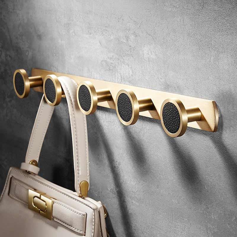 Barre porte manteau dorée