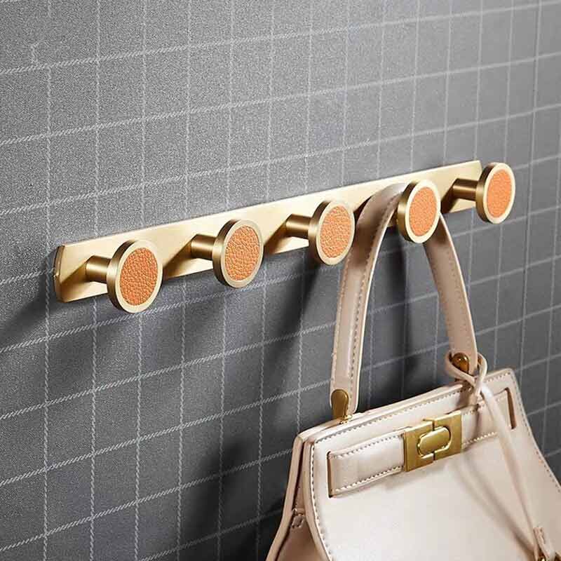 Barre porte manteau dorée